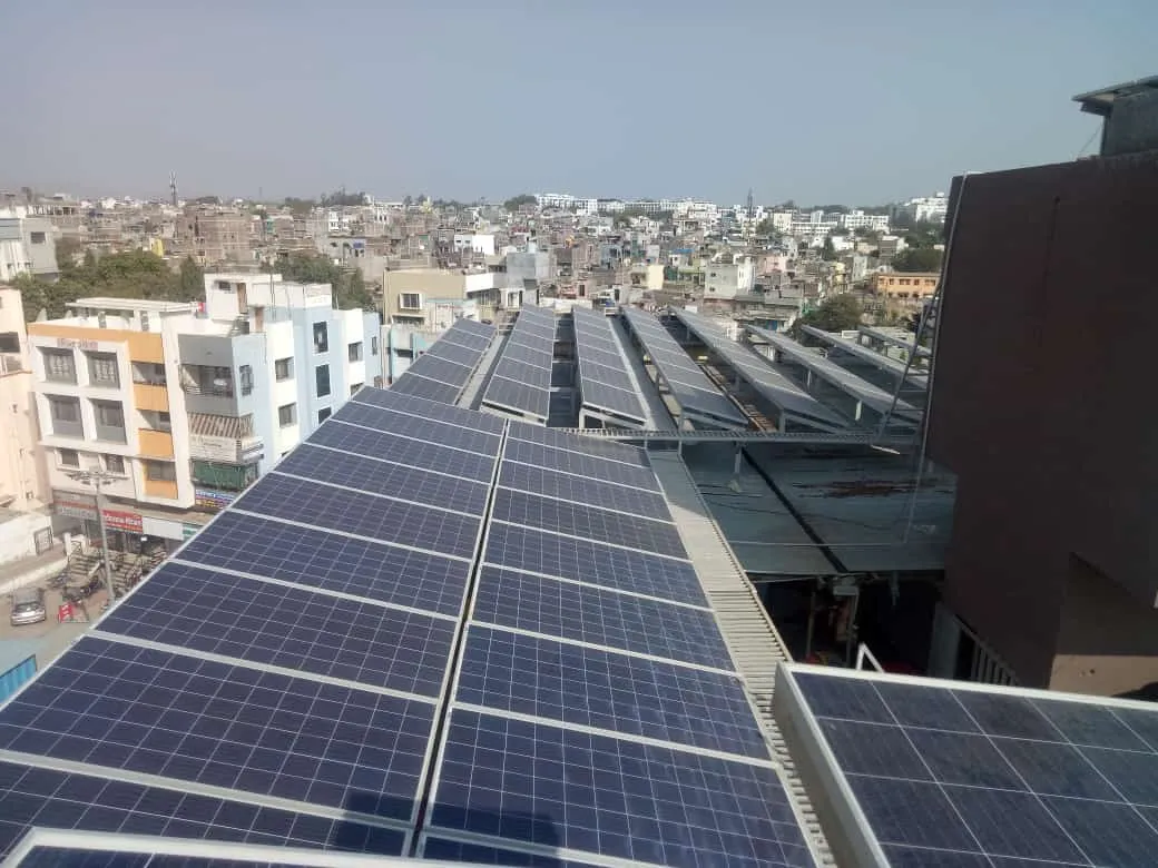 Rooftop commercial solar panel installation on a factory building in Maharashtra